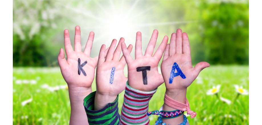 Children Hands Building Word KITA Means Kindergarden, Grass Meadow